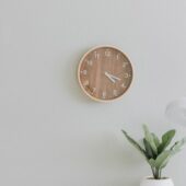 white desk lamp beside green plant